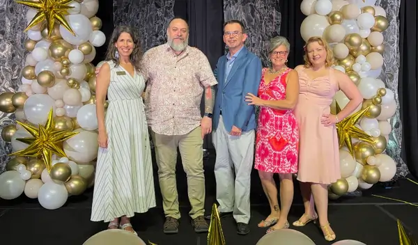 Speaker coach Jason Reid and some of his clients on stage at the Professional Speakers Convention.