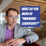 What do you mean by "awkward leadership"? A photo of Jason Reid sitting in a hotel lounge